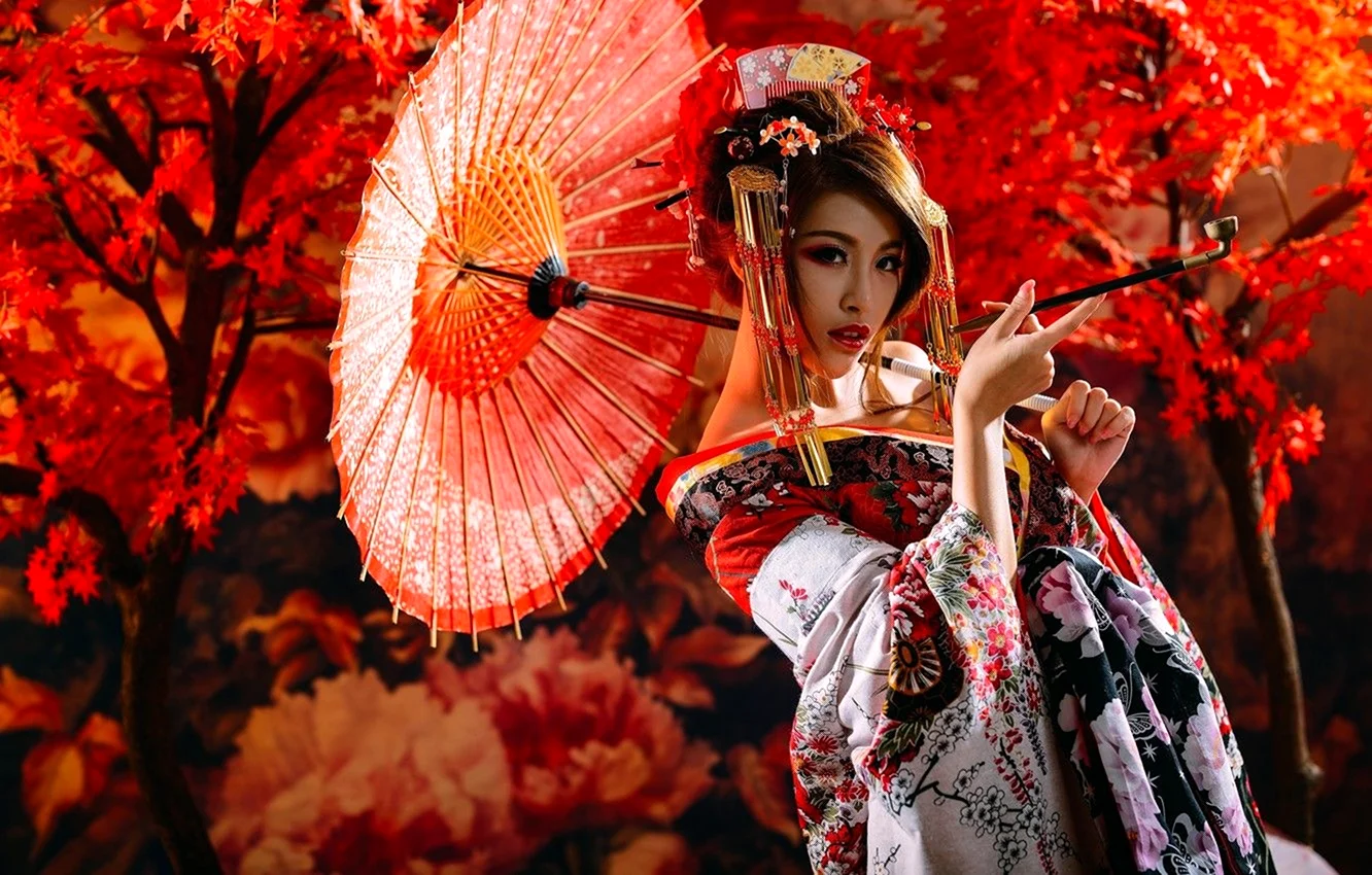 Гейша Японии с зонтиком