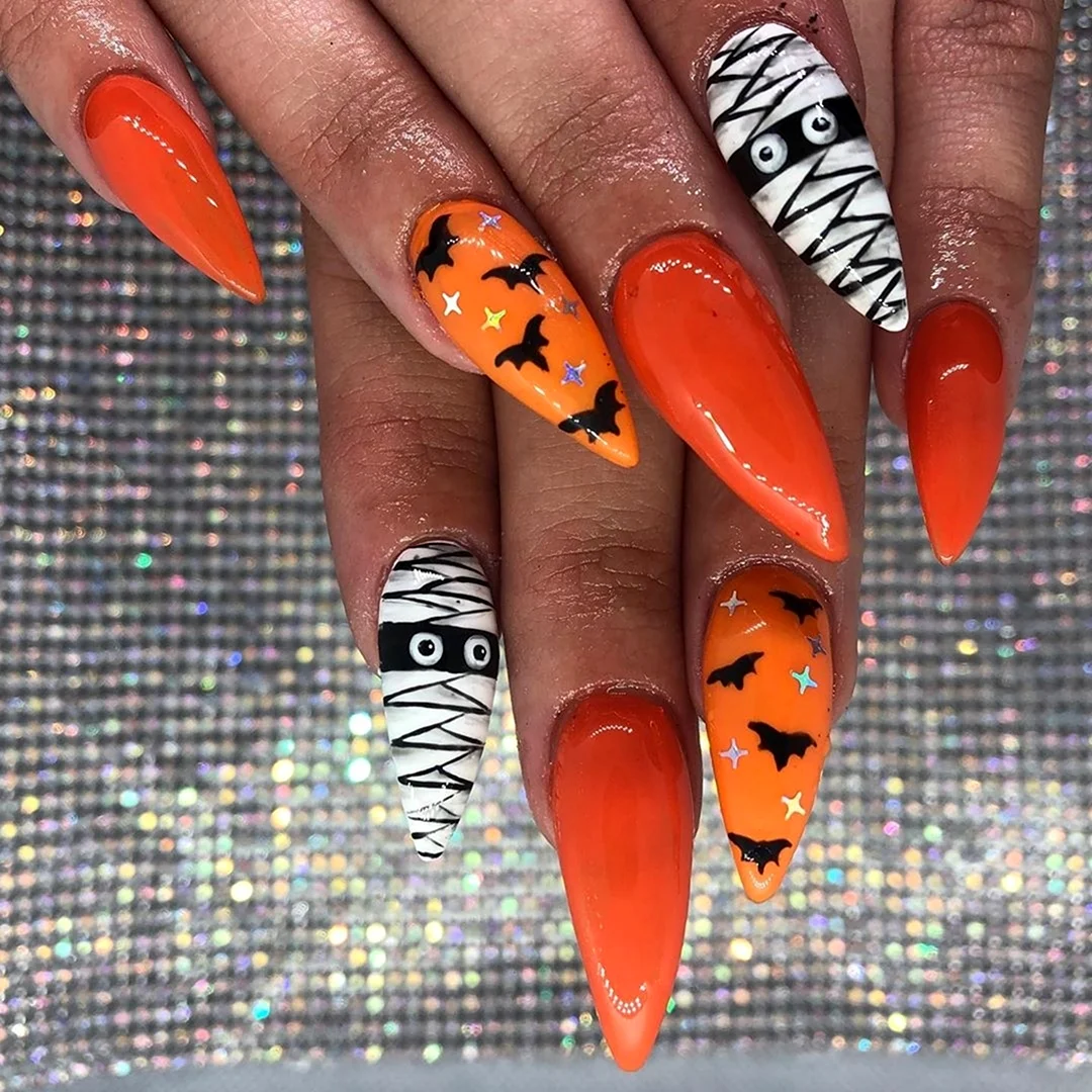 Наращивание ногтей с узорами оранжевый