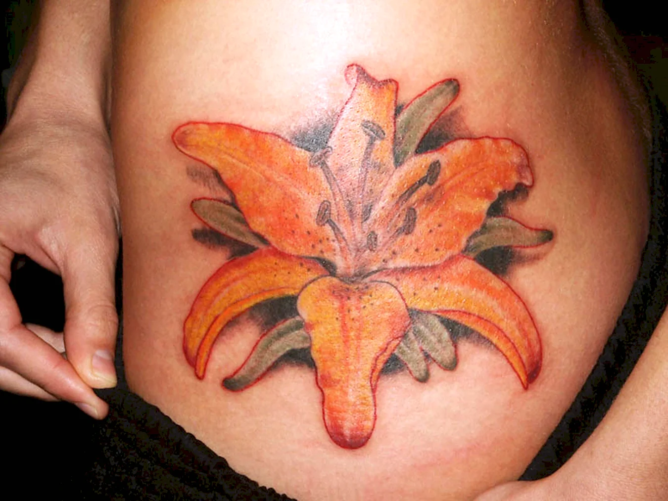 Оранжевые лилии тату