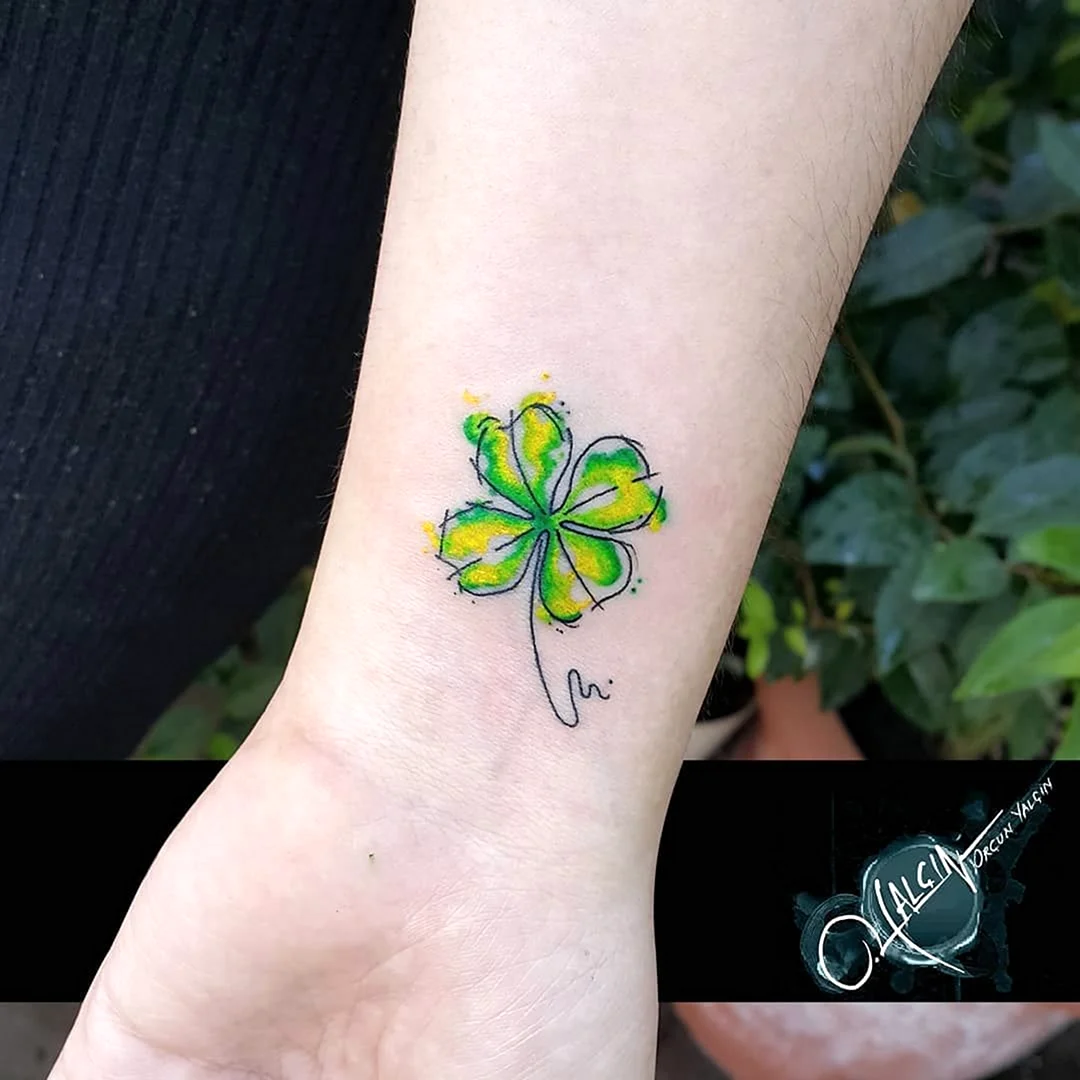 Shamrock Tattoos for girls. A nice Celtic Shamrock Tattoo done magnificently on lower back of a girl.