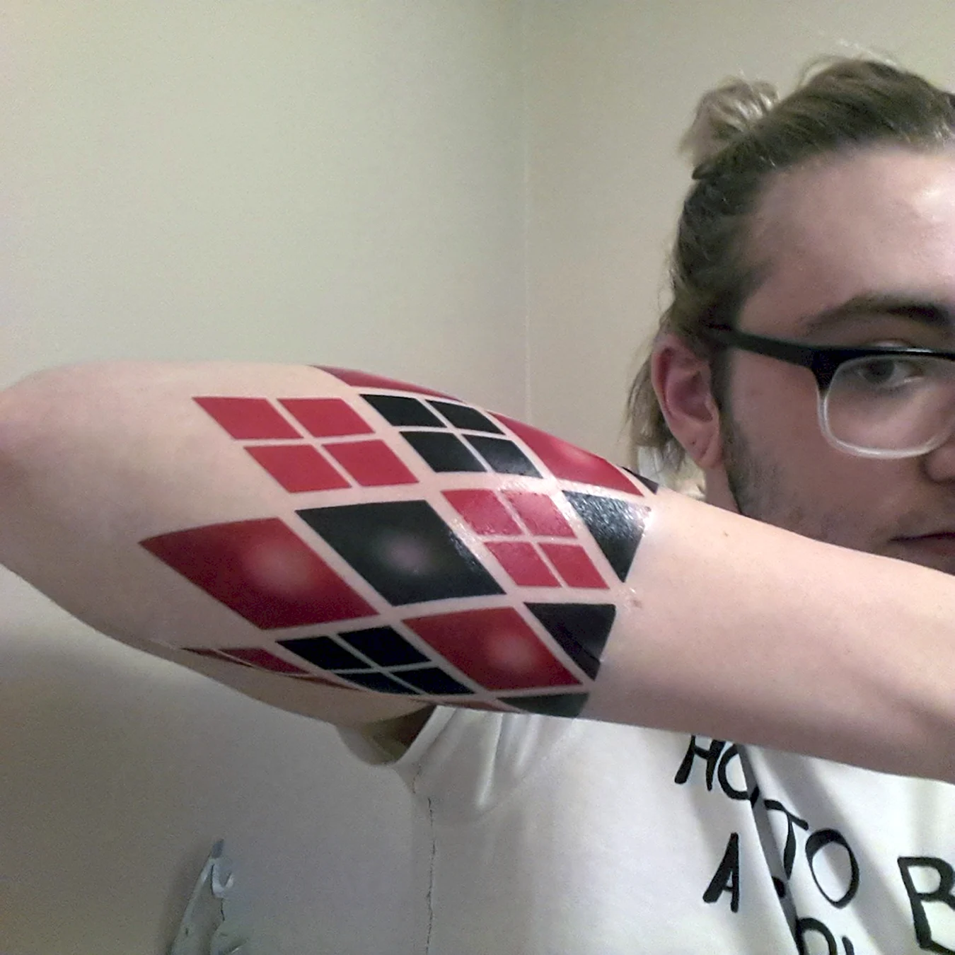 Татуировка Харли Квинн на руке